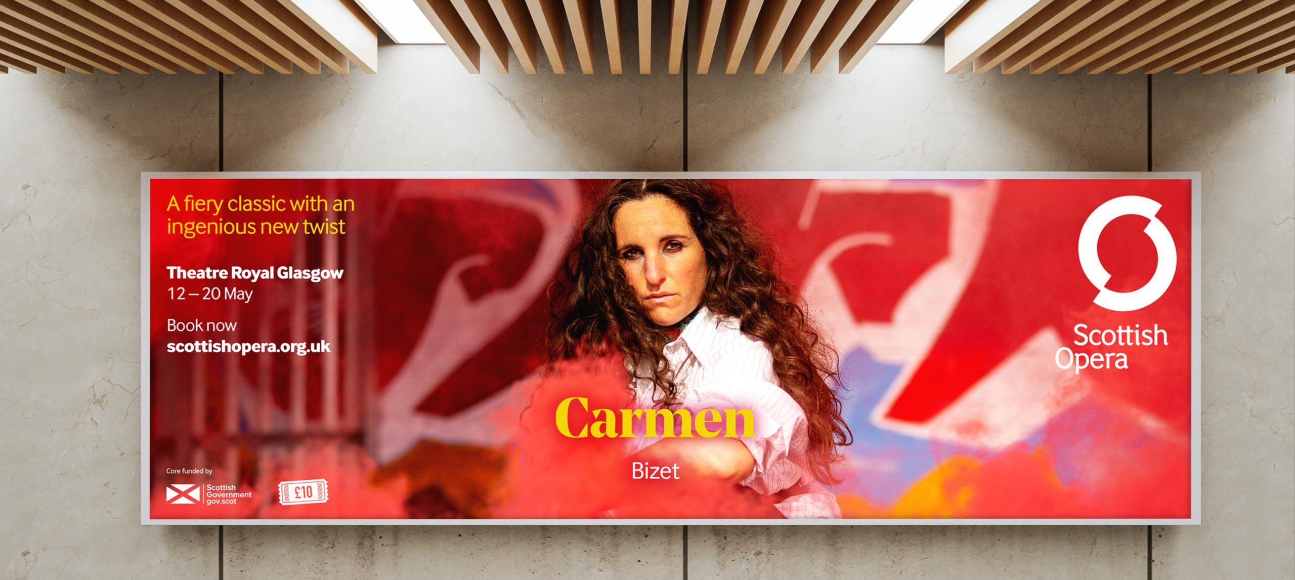 Campaign artwork for an opera called 'Carmen' installed in an outdoor advertising space.